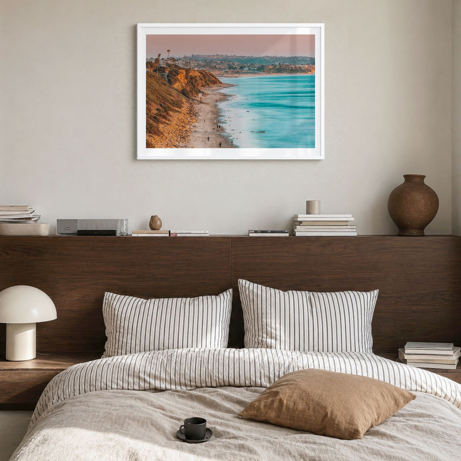Encinitas Photo Poster in a white wood frame, hanging in a bedroom, white border