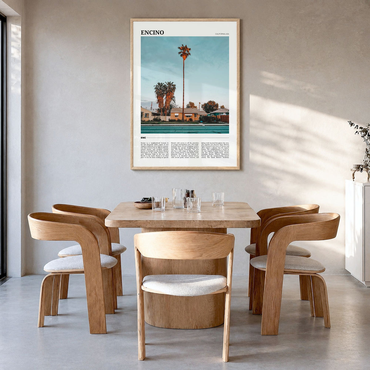 Encino Travel Poster in a natural wood frame, hanging in a dining room