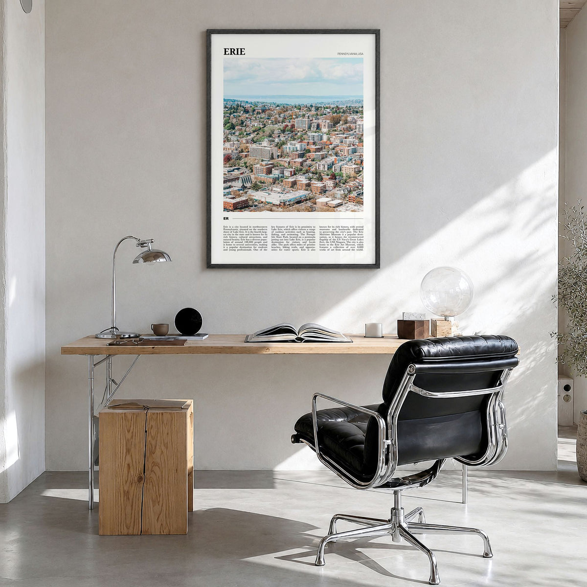 Erie Travel Poster in a black wood frame, hanging in a bright home office