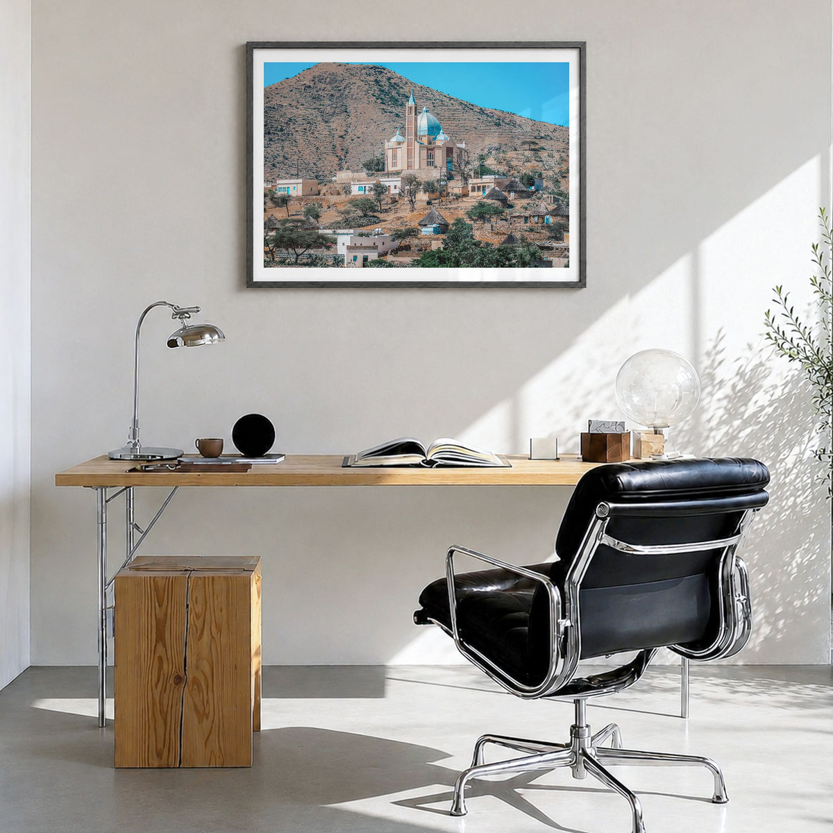 Eritrea Photo Poster in a black wood frame, hanging in a bright home office, white border