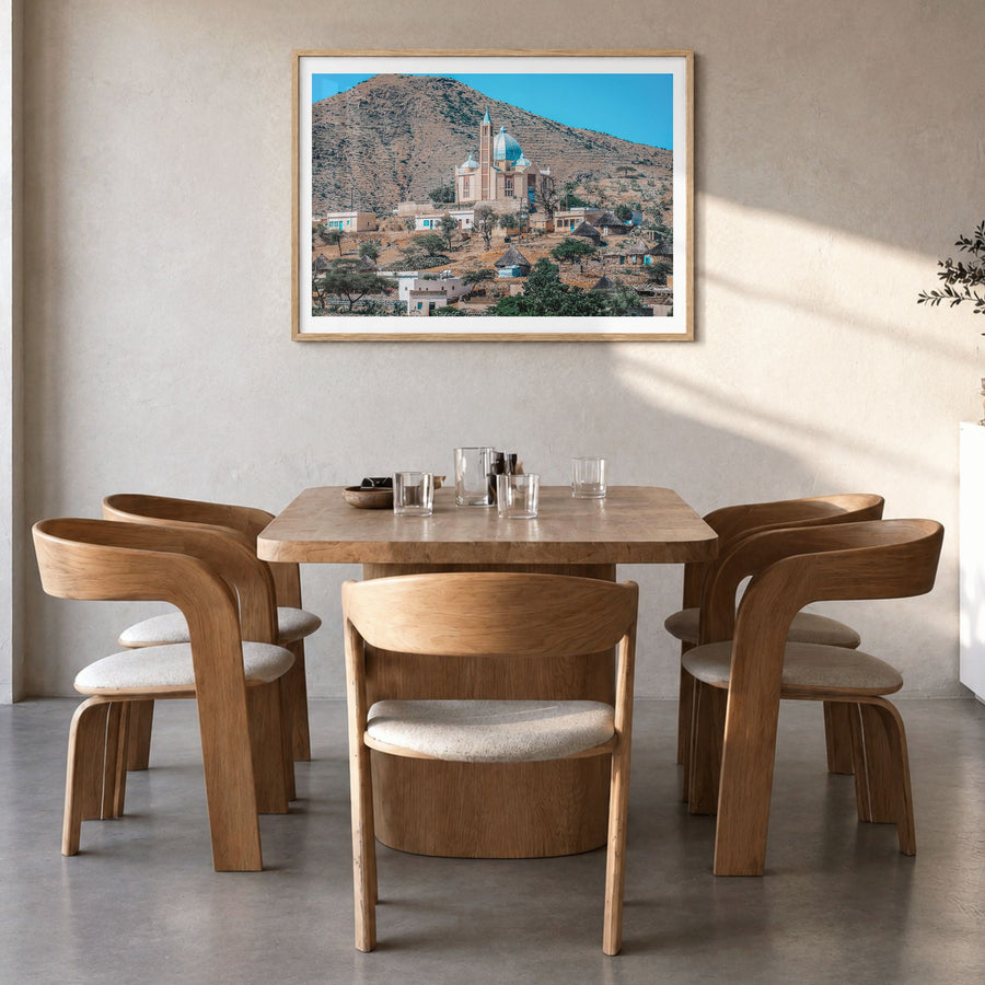 Eritrea Photo Poster in a natural wood frame, hanging in a dining room, white border