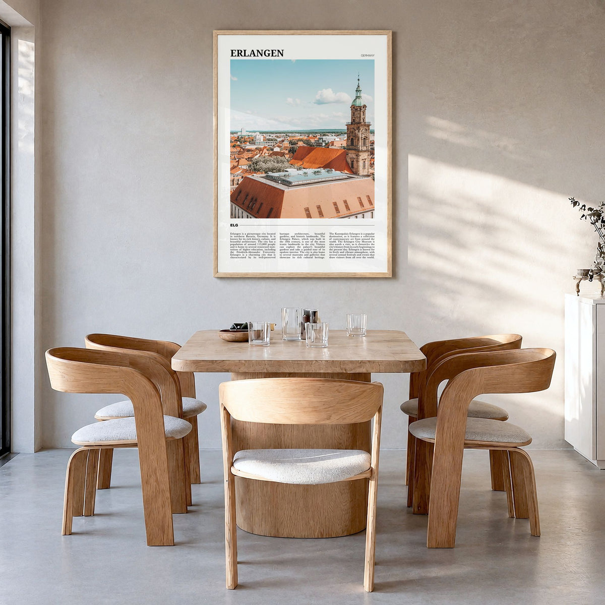 Erlangen Travel Poster in a natural wood frame, hanging in a dining room