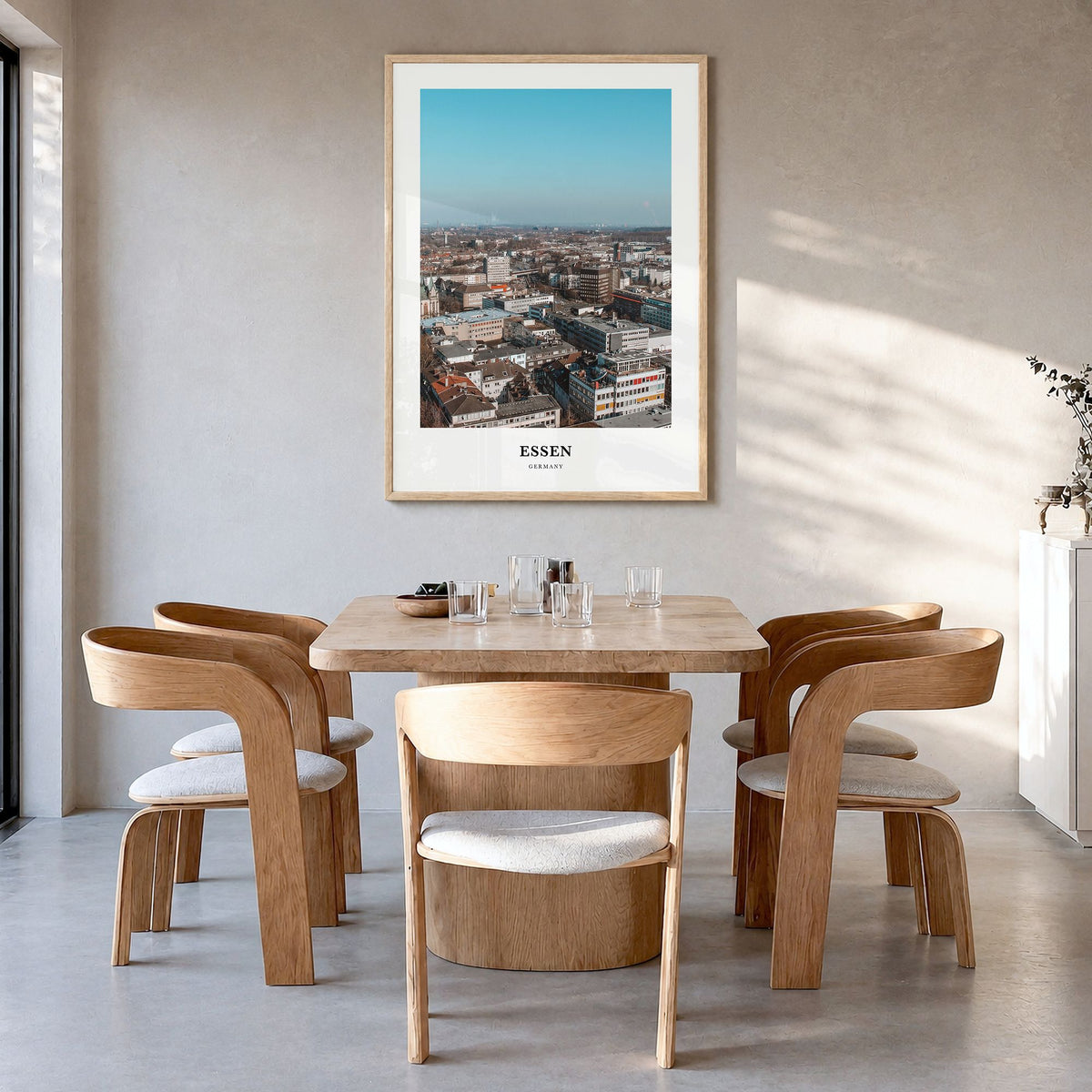 Essen Classic Poster in a natural wood frame, hanging in a dining room