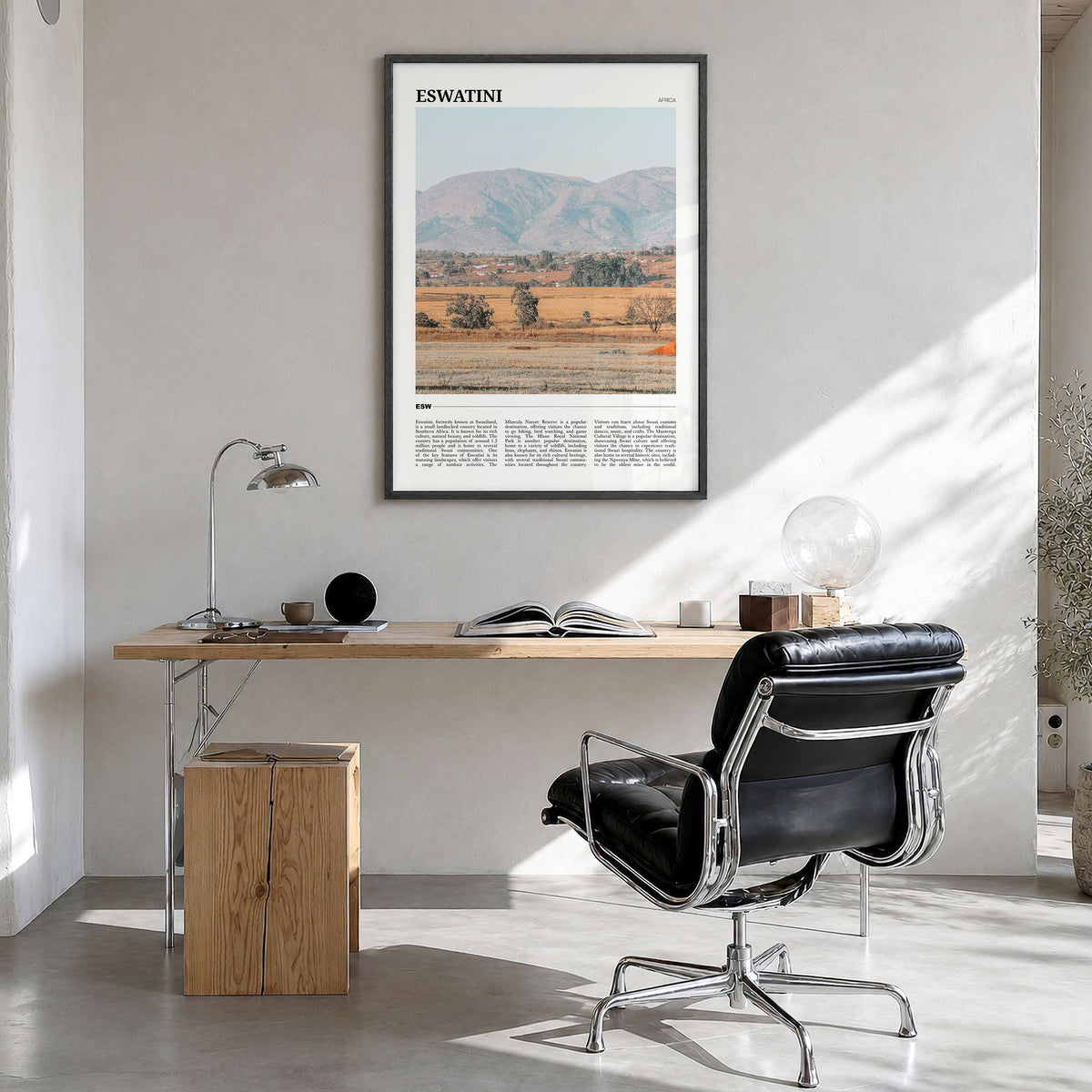 Eswatini Travel Poster in a black wood frame, hanging in a bright home office