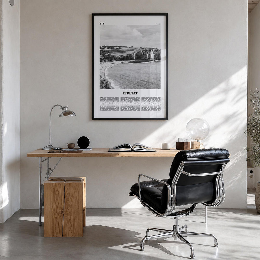 Étretat black & white newspaper poster of France – vertical wall art in black wood frame, hanging on wall