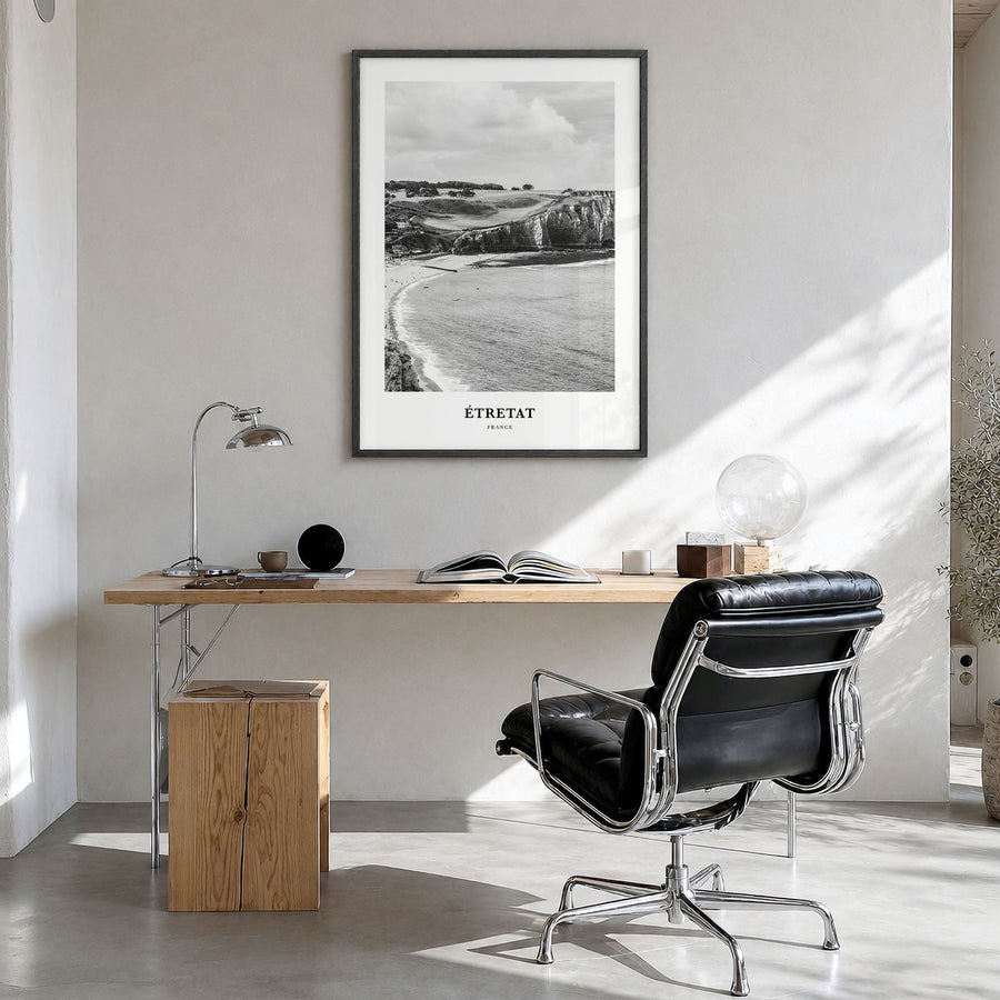 Étretat Classic Poster in a black wood frame, hanging in a bright home office