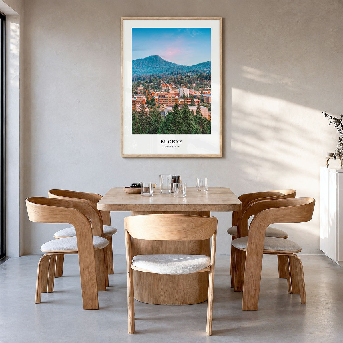 Eugene Classic Poster in a natural wood frame, hanging in a dining room