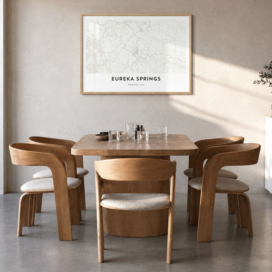 Eureka Springs Map Poster in a natural wood frame, hanging in a dining room