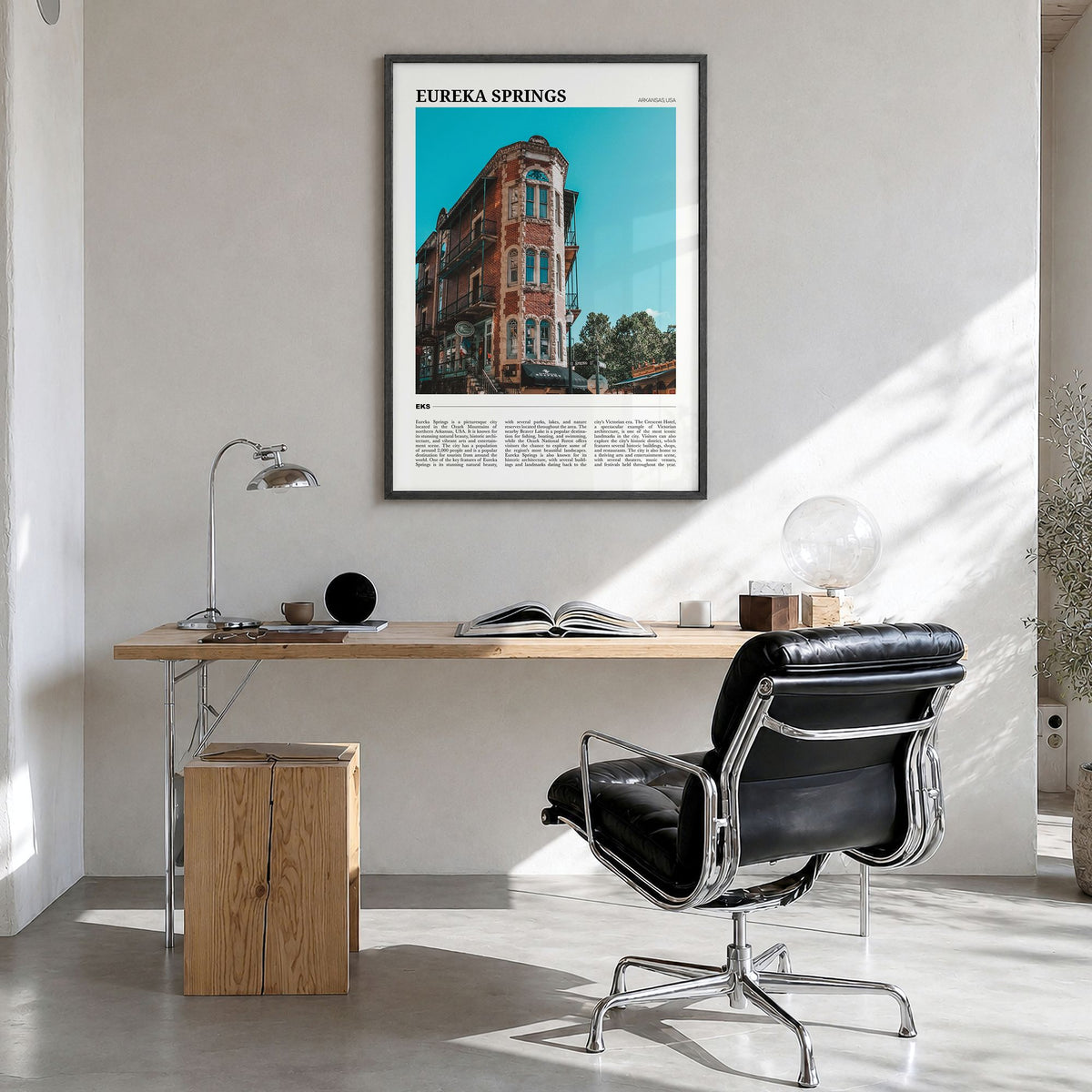 Eureka Springs Travel Poster in a black wood frame, hanging in a bright home office
