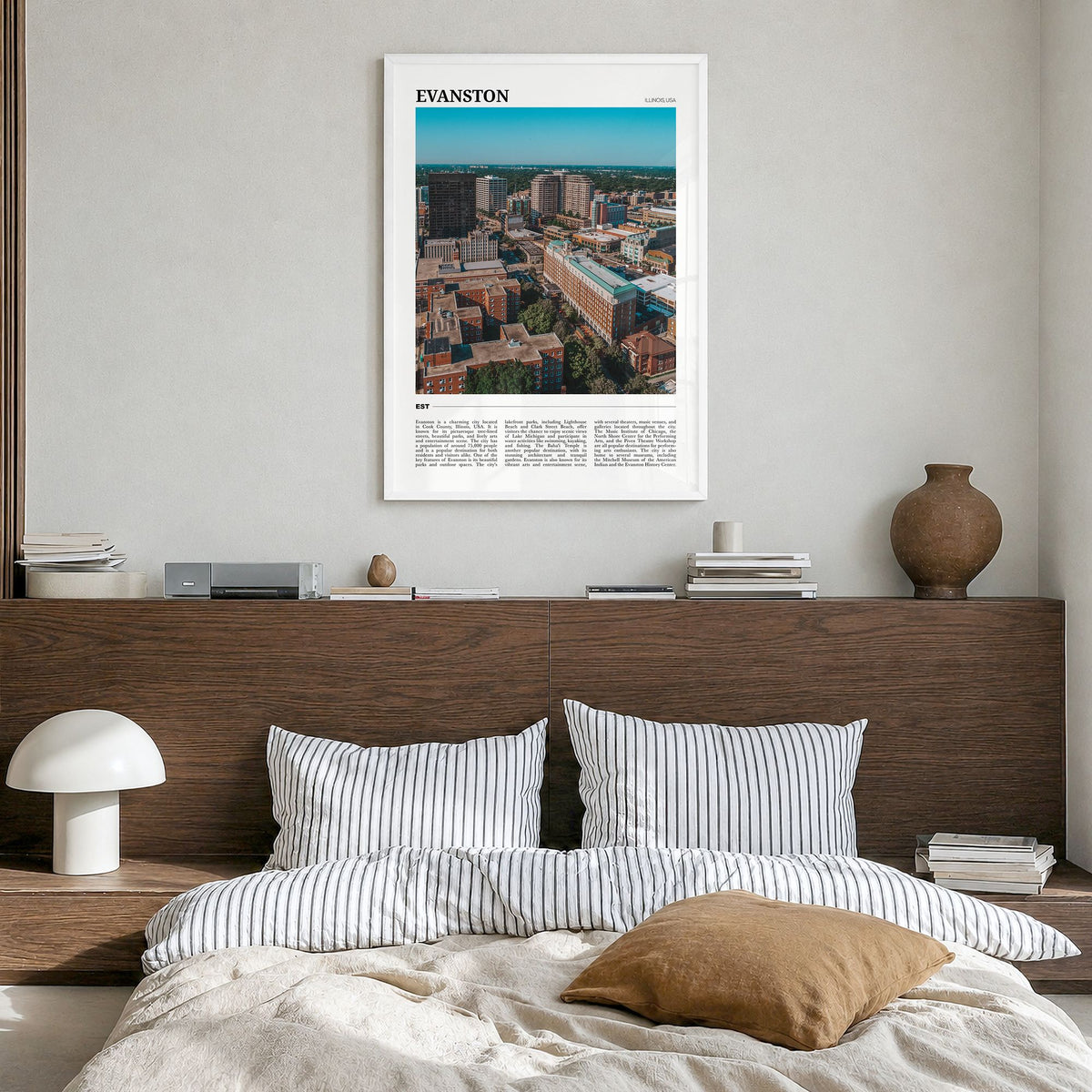 Evanston Travel Poster in a white wood frame, hanging in a bedroom