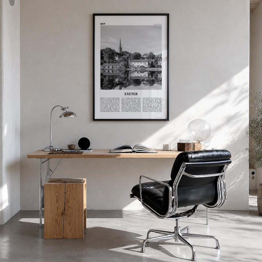 Exeter black & white newspaper poster of England, UK – vertical wall art in black wood frame, hanging on wall