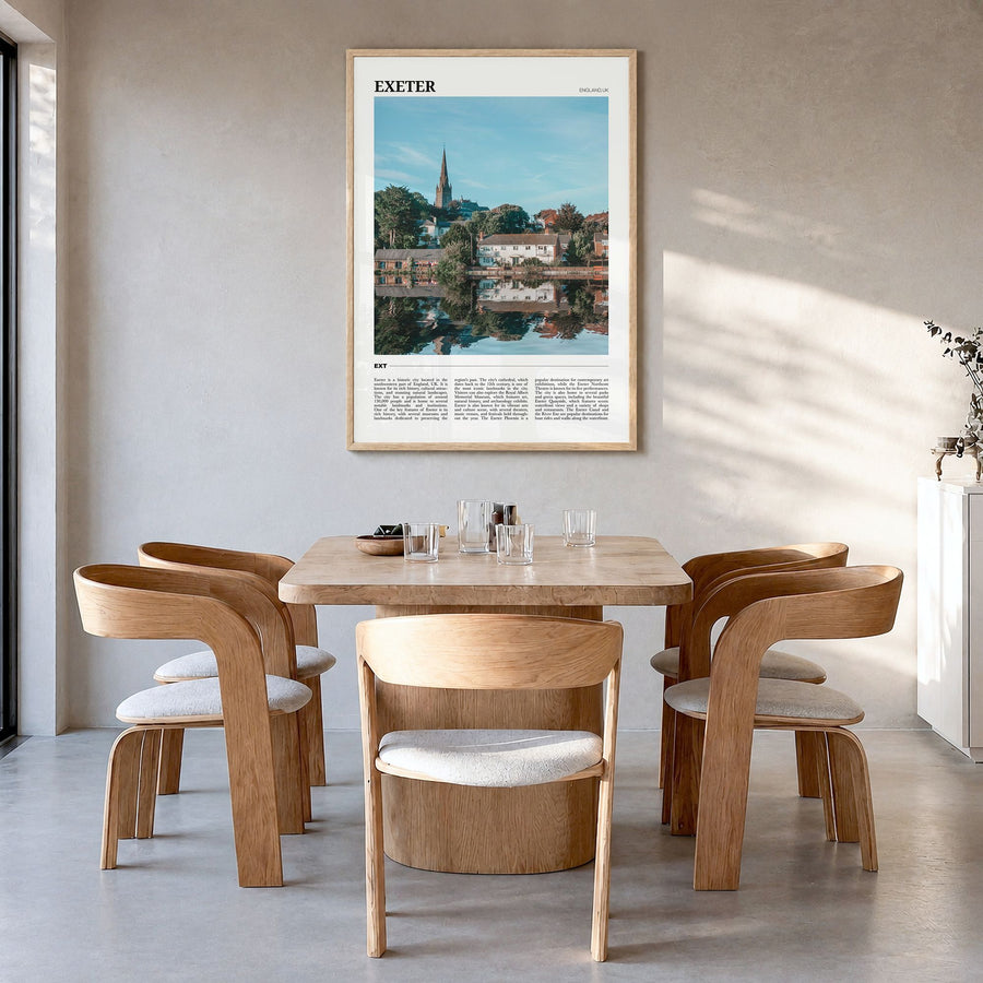 Exeter Travel Poster in a natural wood frame, hanging in a dining room
