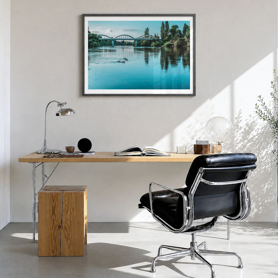 Fairfield Photo Poster in a black wood frame, hanging in a bright home office, white border