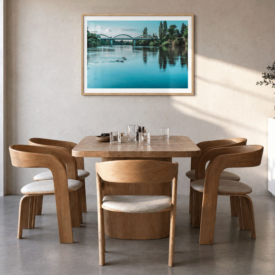 Fairfield Photo Poster in a natural wood frame, hanging in a dining room, white border
