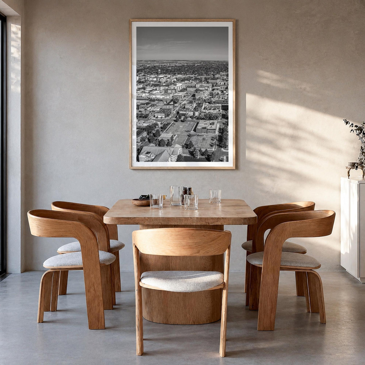 Fargo black & white photo poster of North Dakota, USA – vertical wall art in natural wood frame with white border, hanging on