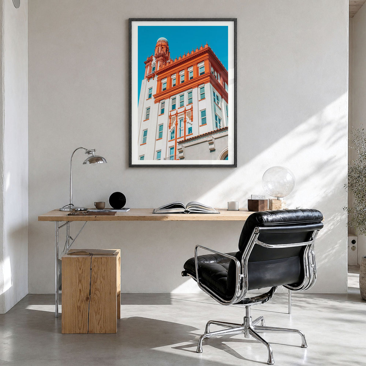 Fargo Photo Poster in a black wood frame, hanging in a bright home office, white border