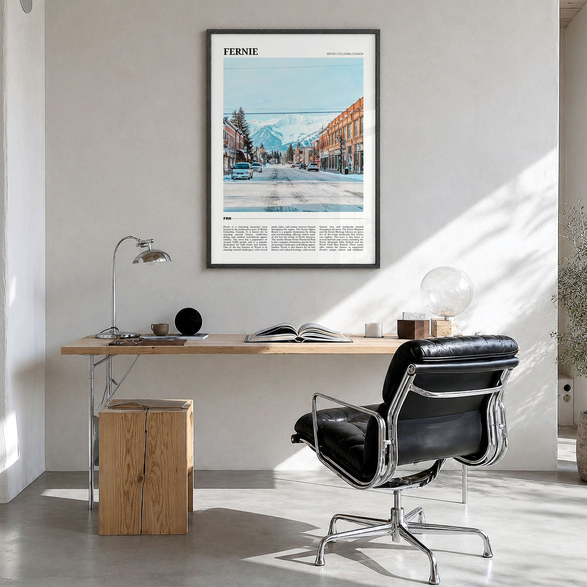 Fernie Travel Poster in a black wood frame, hanging in a bright home office