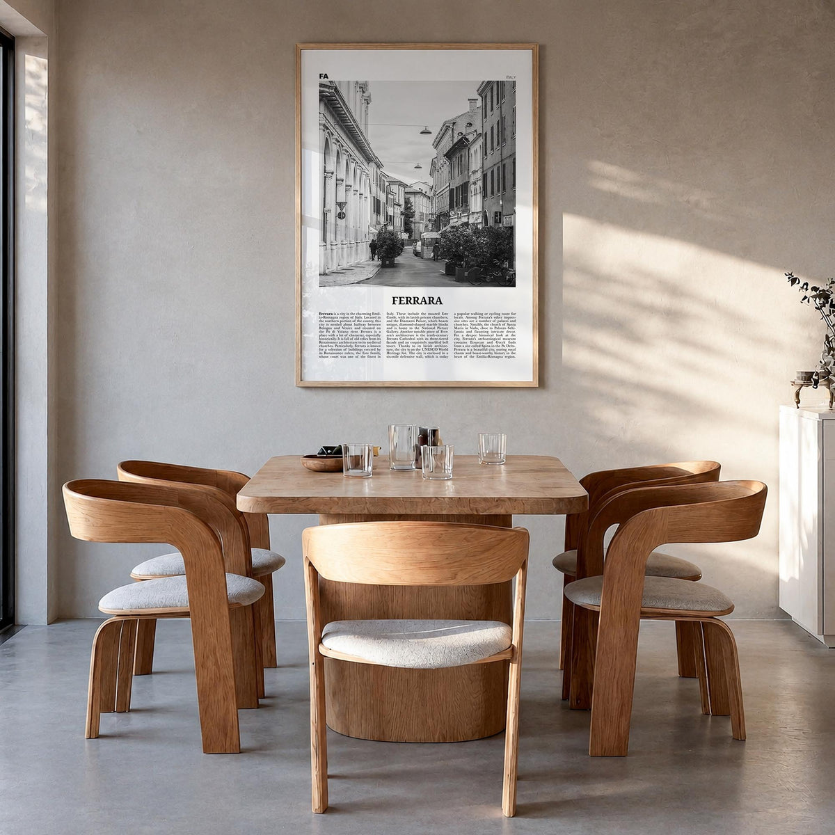 Ferrara black & white newspaper poster of Italy – vertical wall art in natural wood frame, hanging on wall