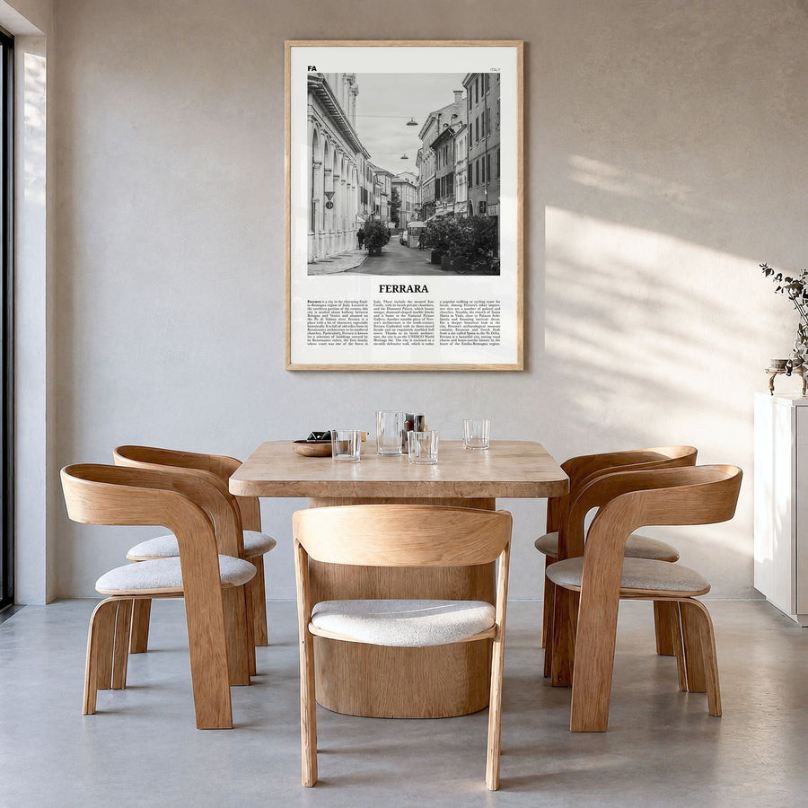 Ferrara Newspaper Poster in a natural wood frame, hanging in a dining room