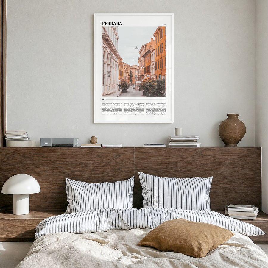 Ferrara Travel Poster in a white wood frame, hanging in a bedroom