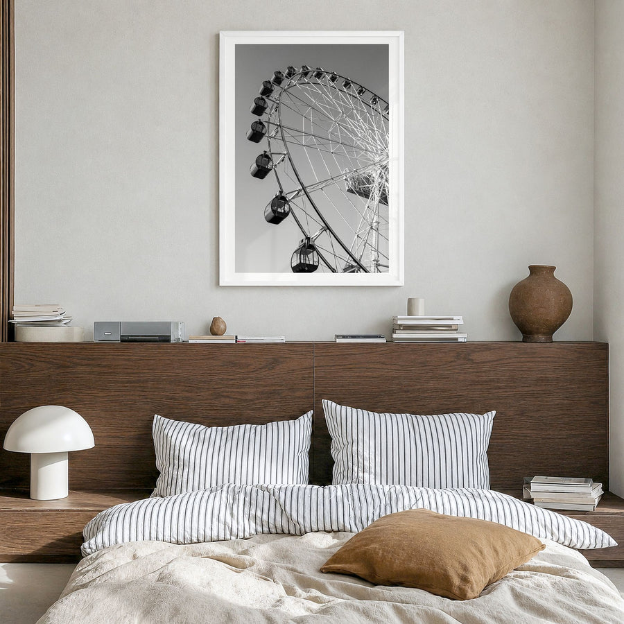 Ferris Wheel Photo Poster in a white wood frame, hanging in a bedroom, white border