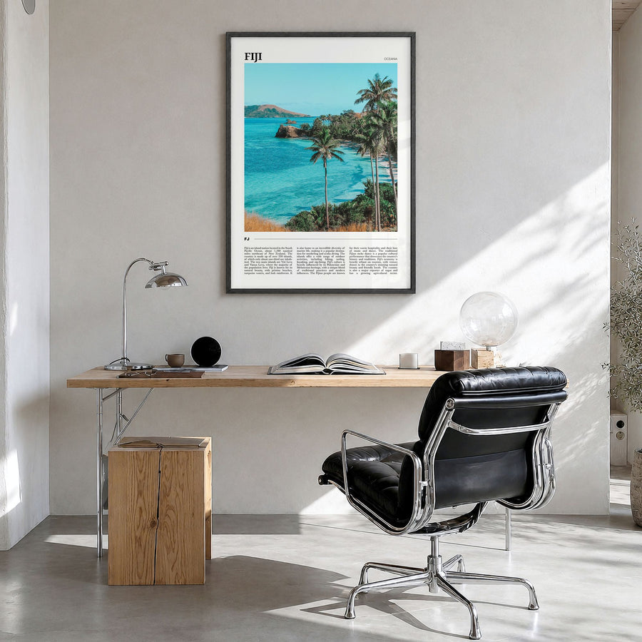 Fiji Travel Poster in a black wood frame, hanging in a bright home office