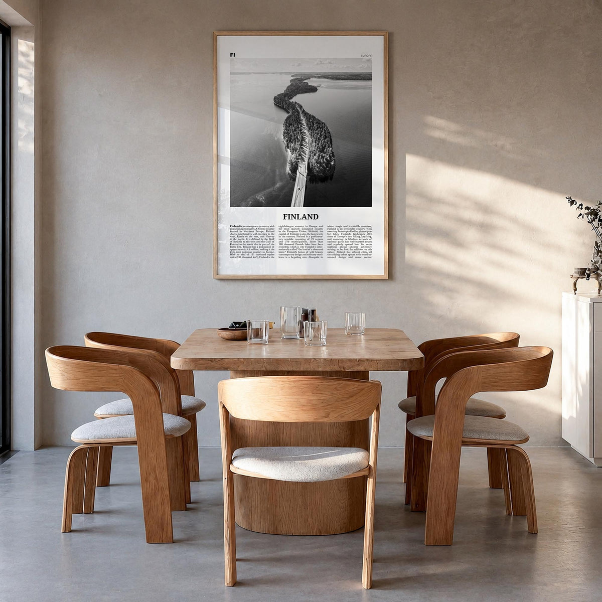 Finland black & white newspaper poster of Europe – vertical wall art in natural wood frame, hanging on wall