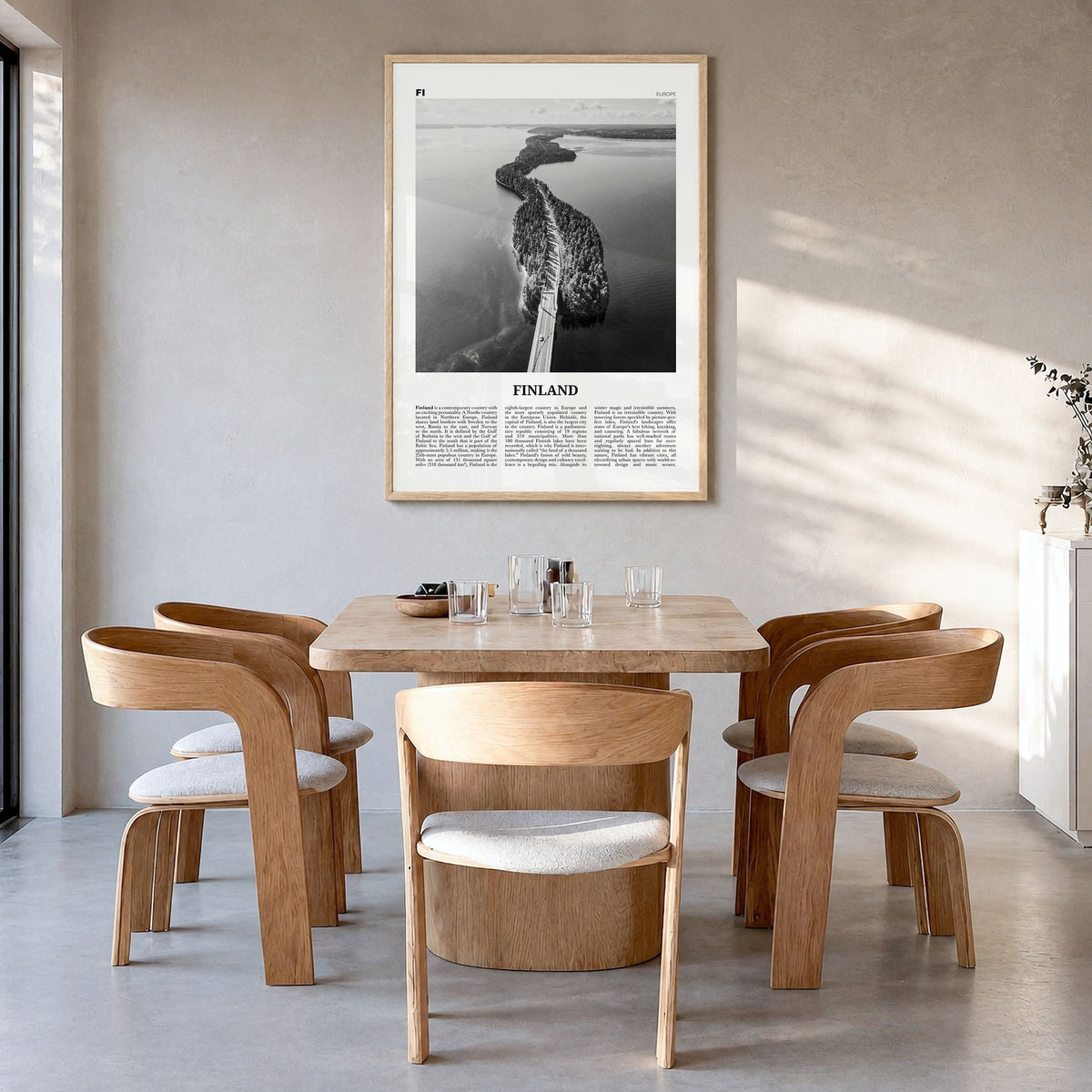 Finland Newspaper Poster in a natural wood frame, hanging in a dining room