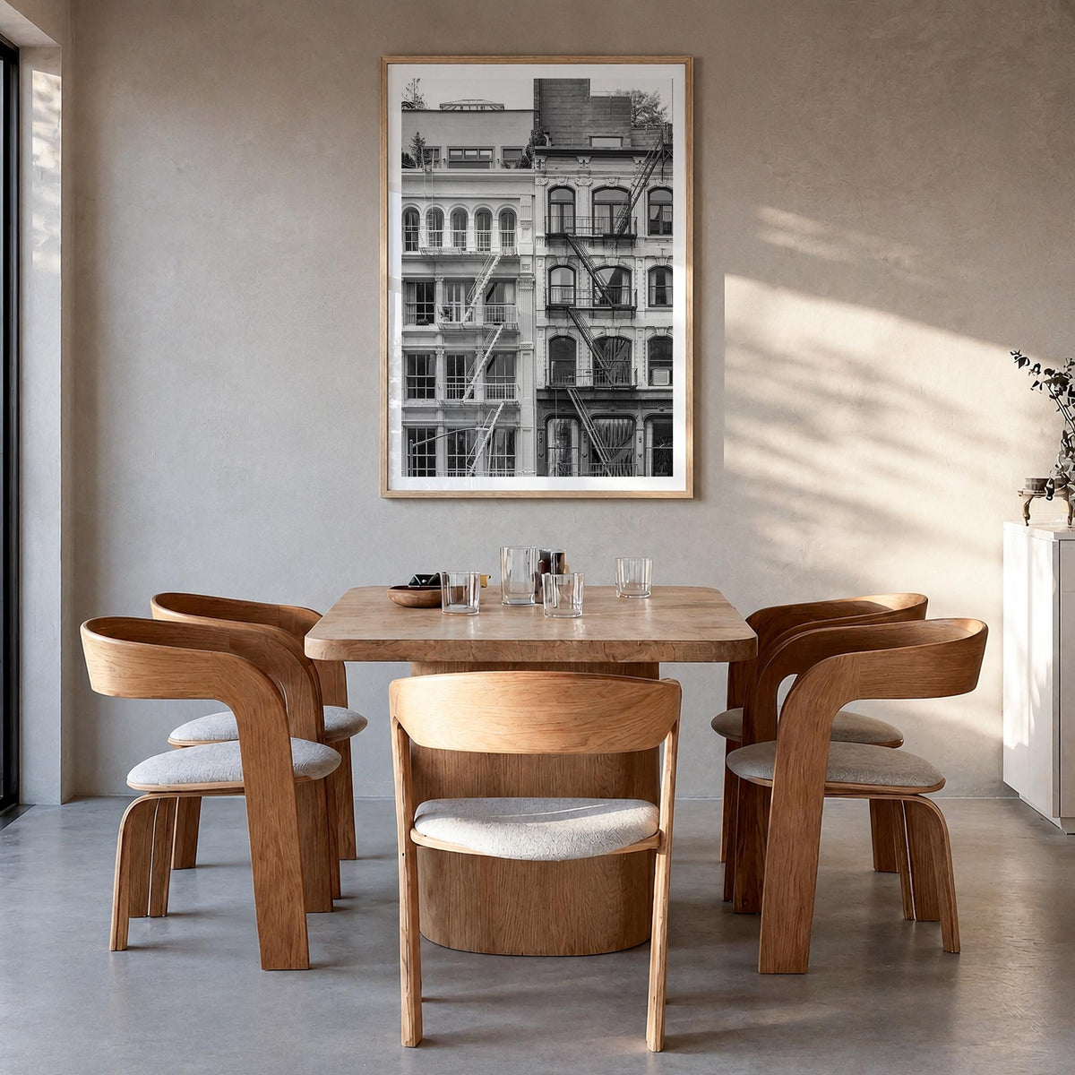 Fire Escapes no. 2 black & white photo poster – vertical wall art in natural wood frame with white border, hanging on wall