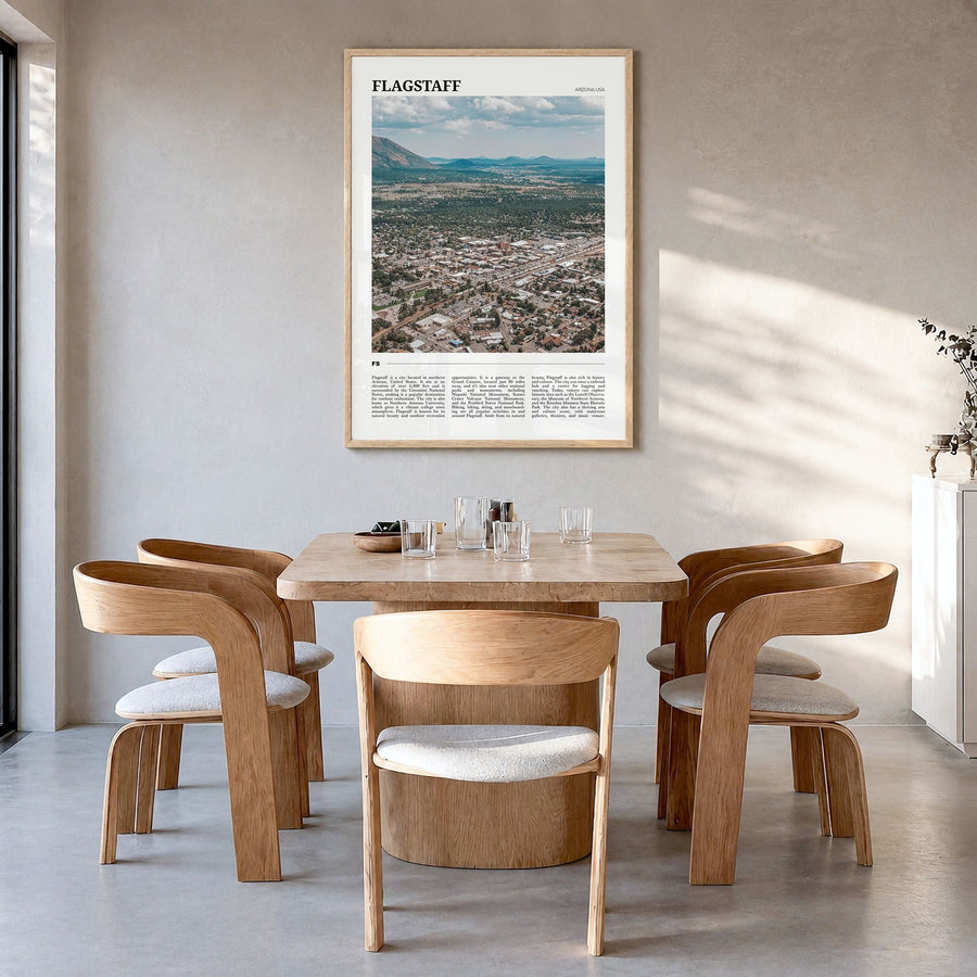 Flagstaff Travel Poster in a natural wood frame, hanging in a dining room