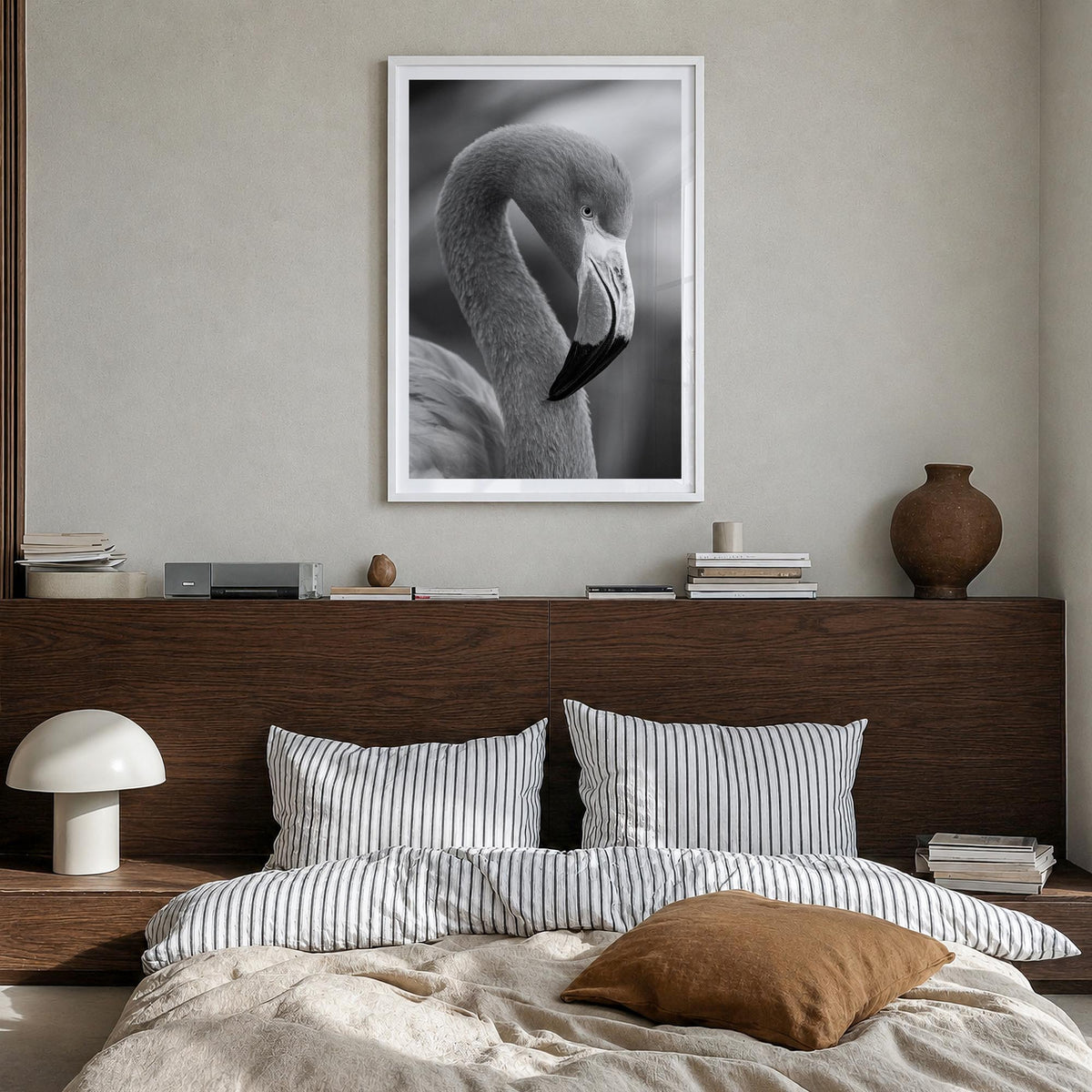 Flamingo black & white photo poster – vertical wall art in white wood frame with white border, hanging on wall