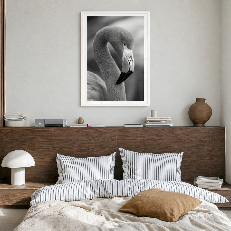 Flamingo Photo Poster in a white wood frame, hanging in a bedroom, white border