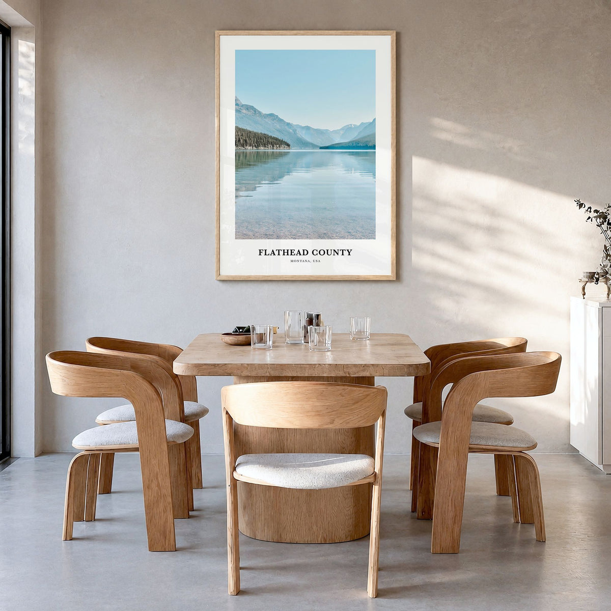 Flathead County Classic Poster in a natural wood frame, hanging in a dining room