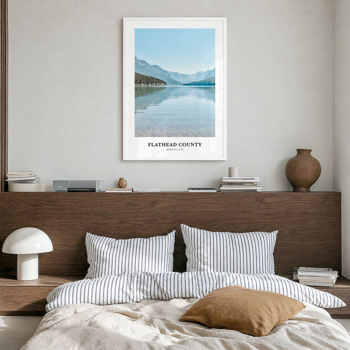Flathead County Classic Poster in a white wood frame, hanging in a bedroom