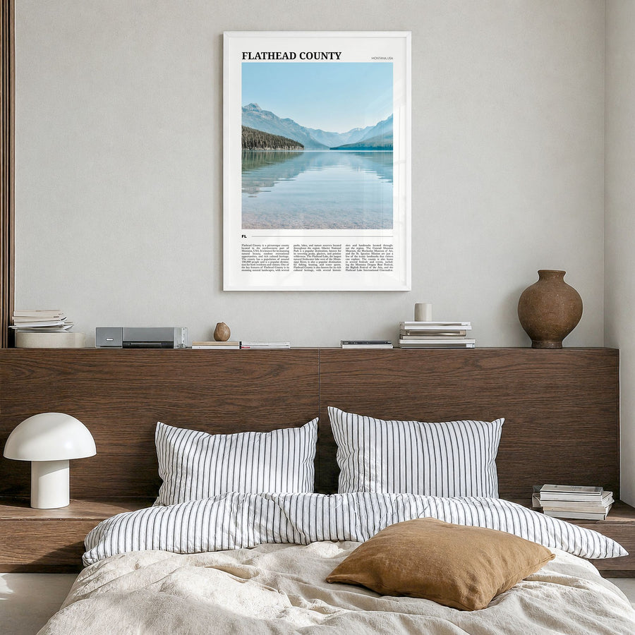 Flathead County Travel Poster in a white wood frame, hanging in a bedroom