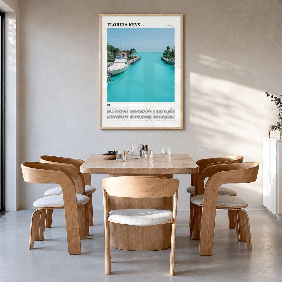 Florida Keys Travel Poster in a natural wood frame, hanging in a dining room
