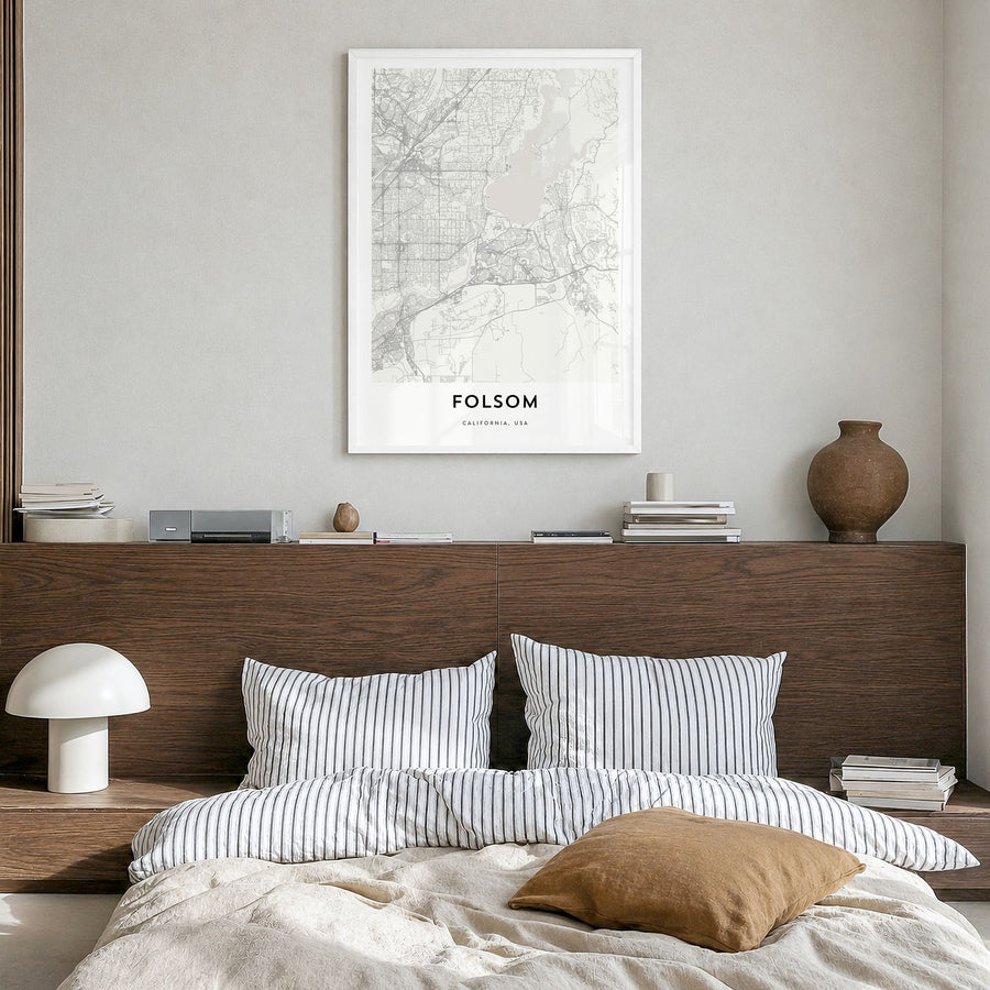 Folsom Map Poster in a white wood frame, hanging in a bedroom