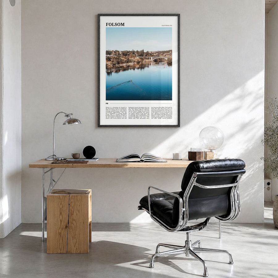 Folsom Travel Poster in a black wood frame, hanging in a bright home office
