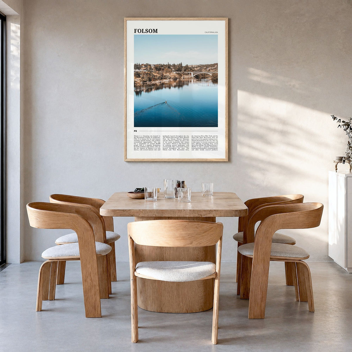 Folsom Travel Poster in a natural wood frame, hanging in a dining room