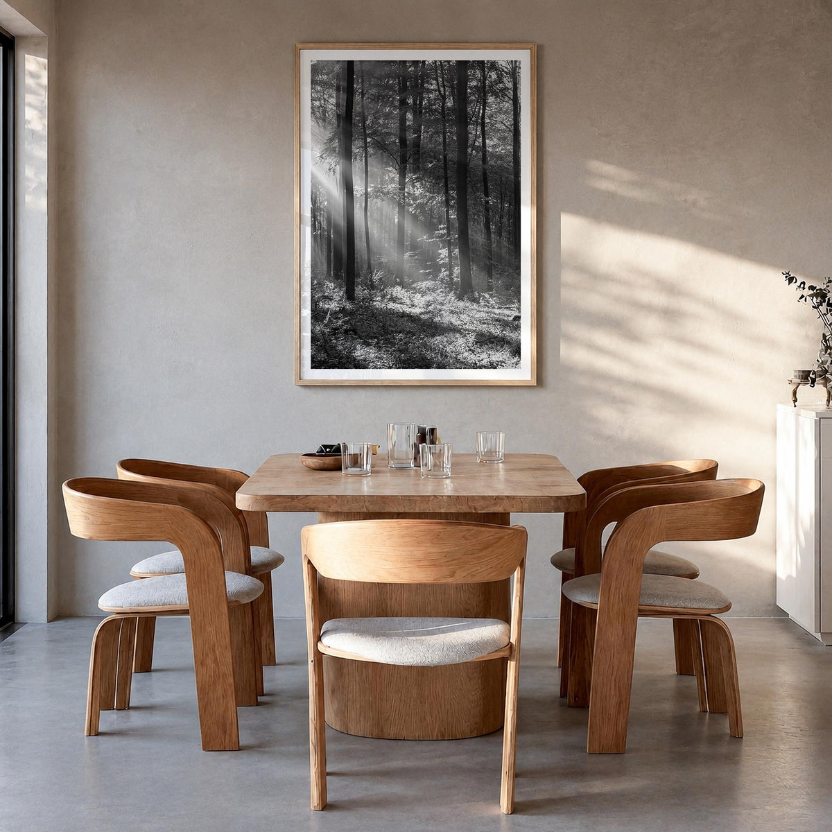 Forest black & white photo poster – vertical wall art in natural wood frame with white border, hanging on wall