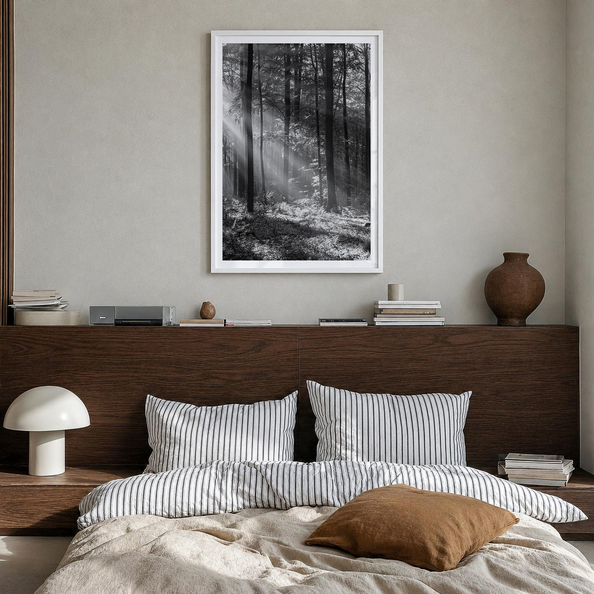 Forest black & white photo poster – vertical wall art in white wood frame with white border, hanging on wall