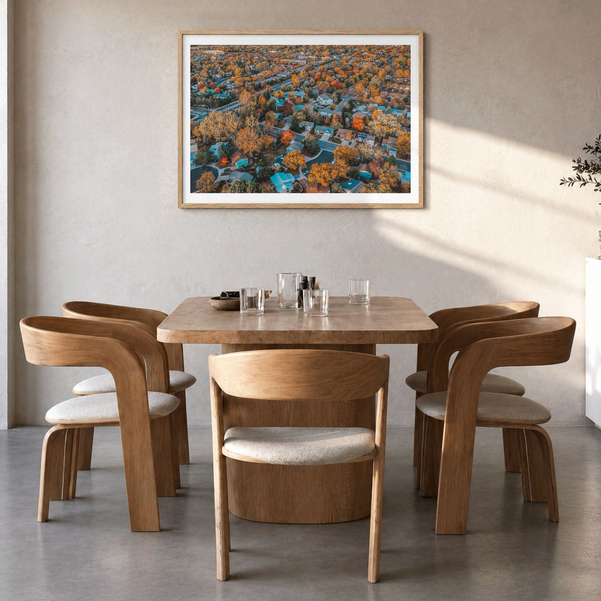 Fort Collins Photo Poster in a natural wood frame, hanging in a dining room, white border