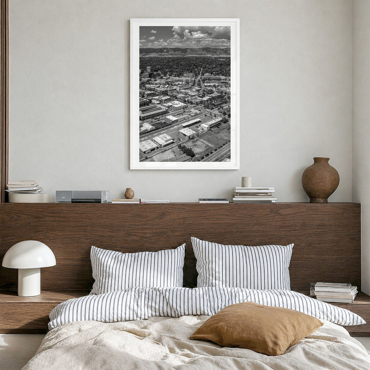 Fort Collins Photo Poster in a white wood frame, hanging in a bedroom, white border