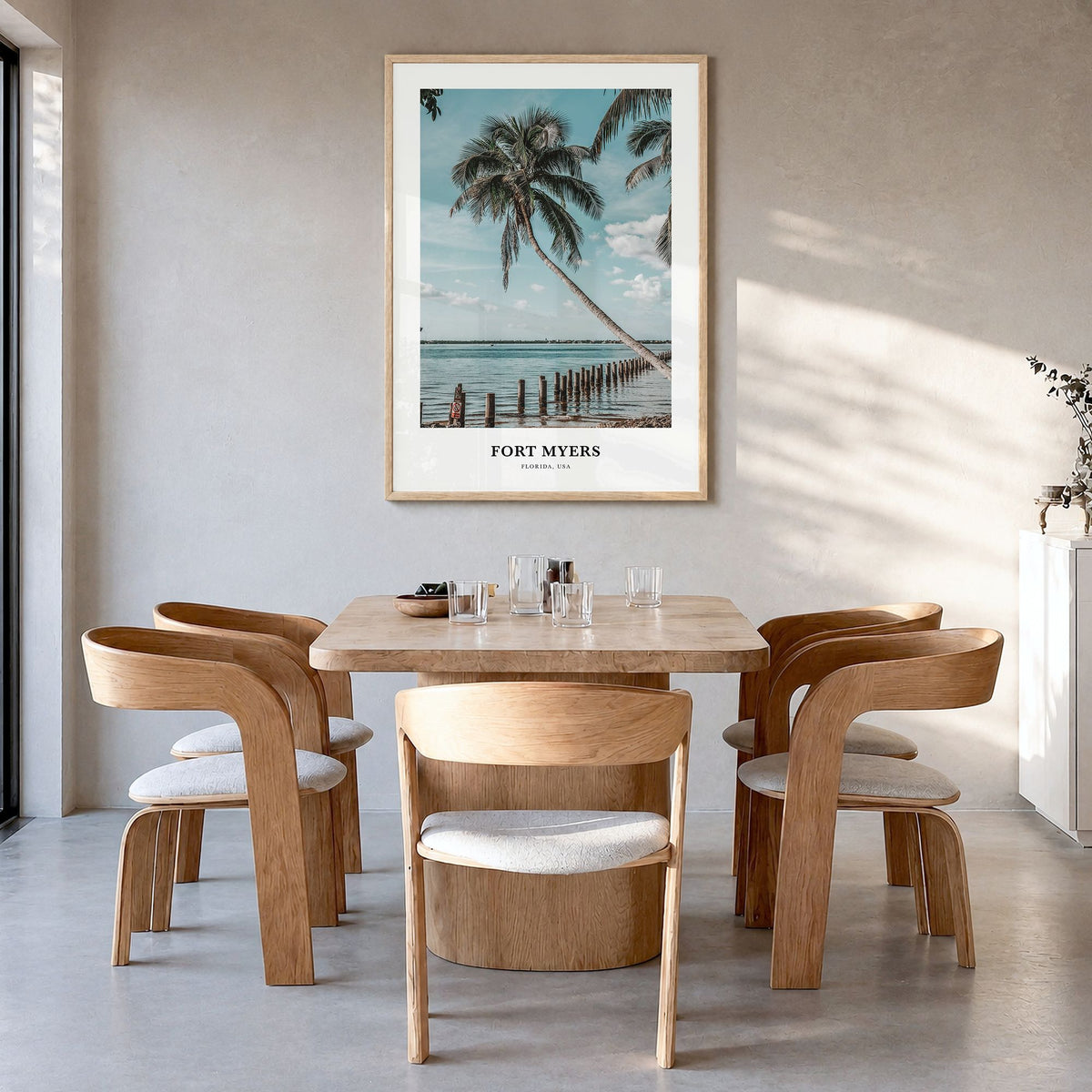 Fort Myers Classic Poster in a natural wood frame, hanging in a dining room