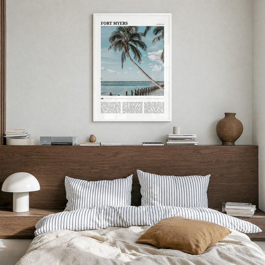 Fort Myers Travel Poster in a white wood frame, hanging in a bedroom