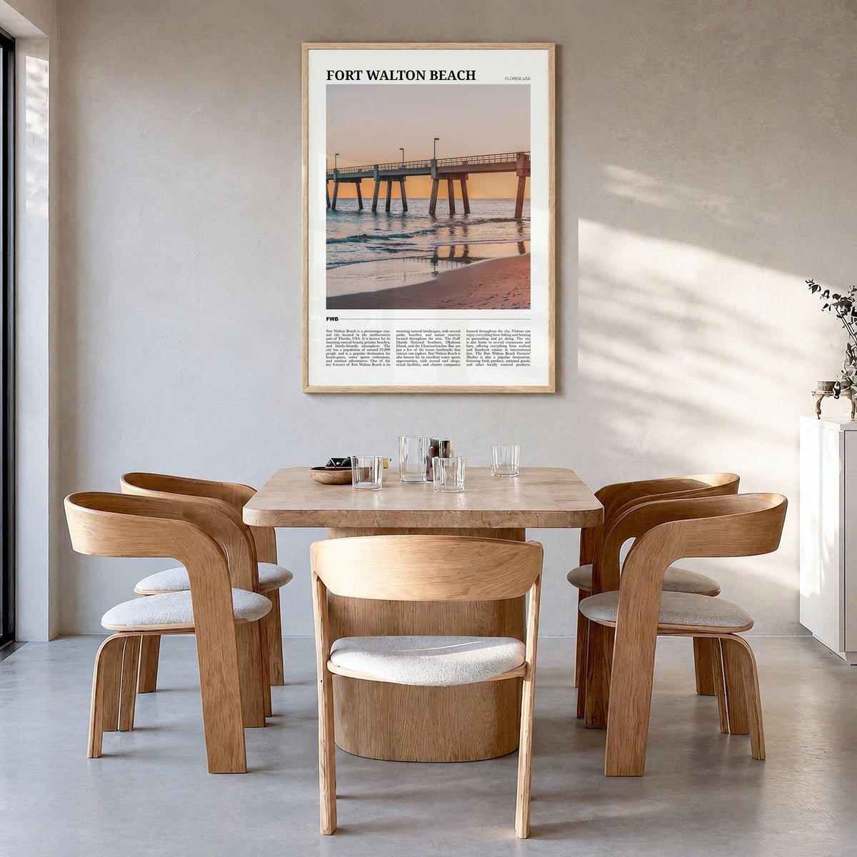 Fort Walton Beach Travel Poster in a natural wood frame, hanging in a dining room
