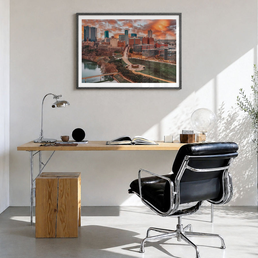 Fort Worth Photo Poster in a black wood frame, hanging in a bright home office, white border
