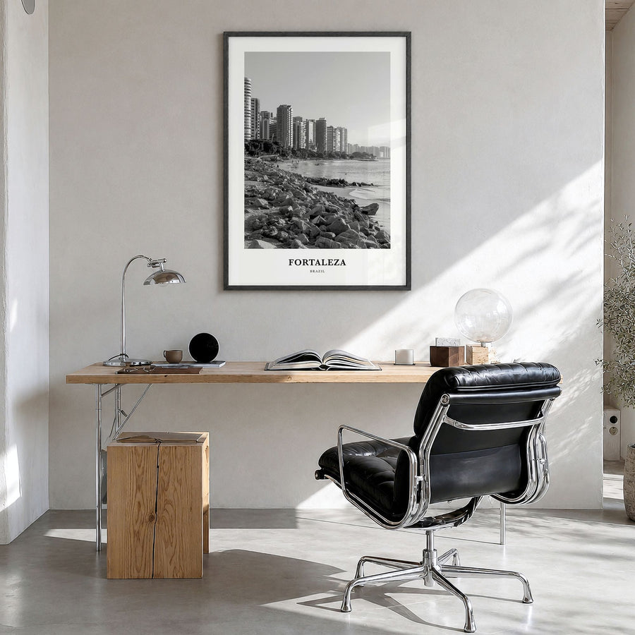 Fortaleza Classic Poster in a black wood frame, hanging in a bright home office