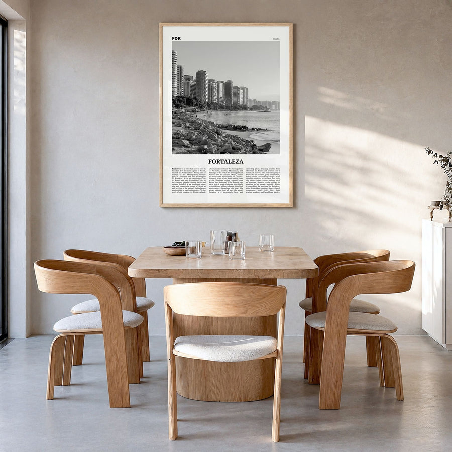 Fortaleza Newspaper Poster in a natural wood frame, hanging in a dining room