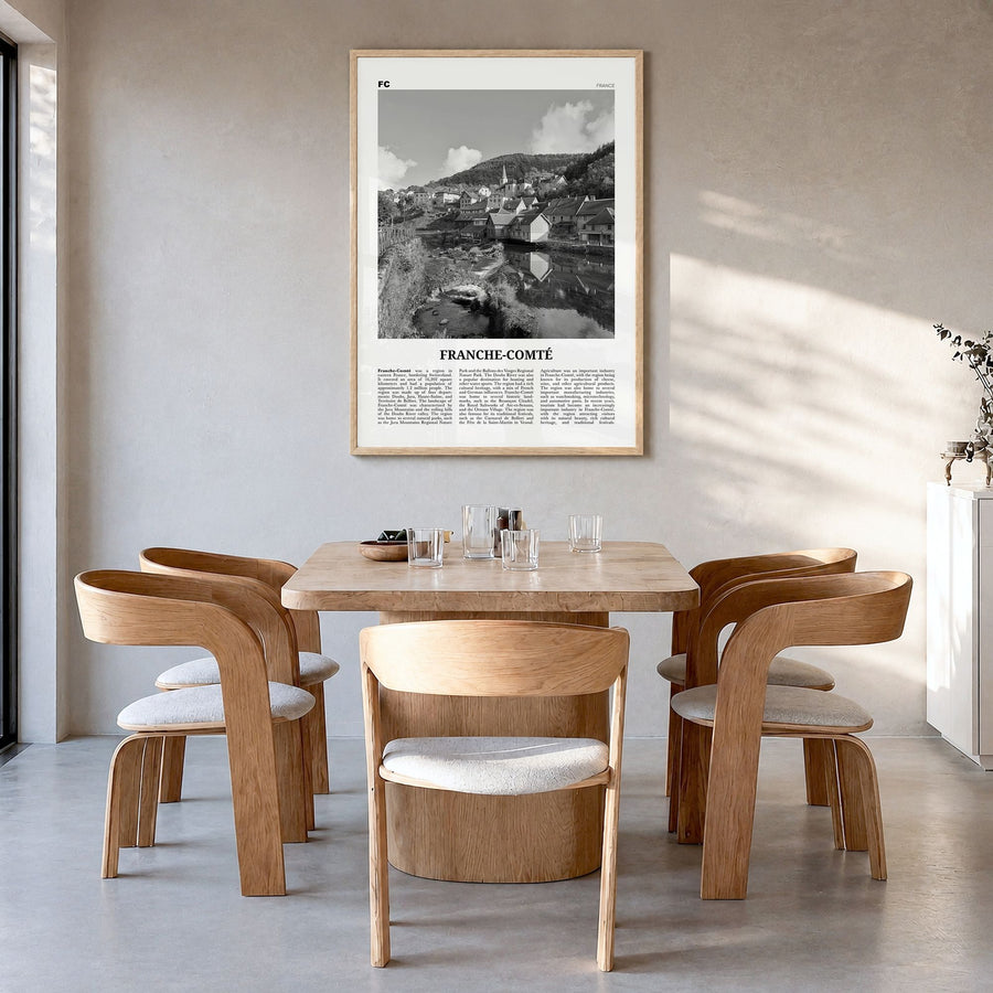 Franche-Comté Newspaper Poster in a natural wood frame, hanging in a dining room